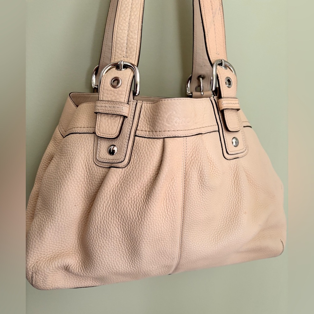 Coach Leather,ivory handbag w/pink lining.Good condition.Pebbled leather.10x15x5